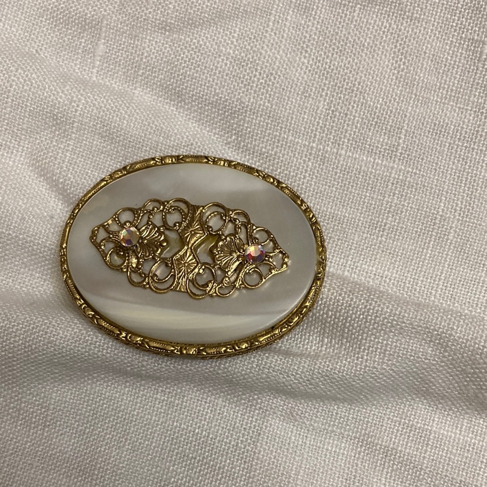 Gold plated brooch.